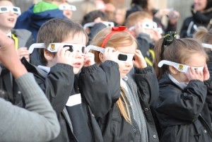 Junior children at Stockport Grammar School are watching solar eclipse.