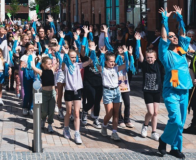 Many Hands parade at MHF | photo by Lawrence Ghorra