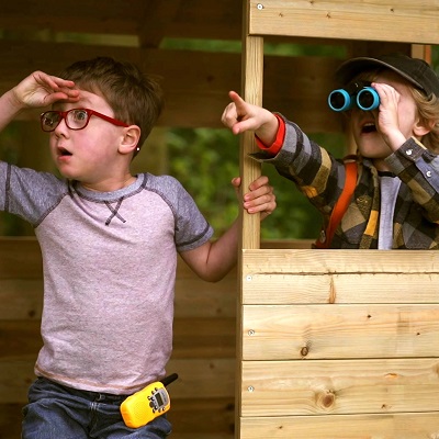 Children are playing outdoors in treetops playhouse