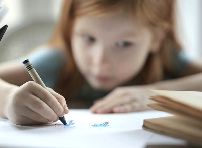 Girl writing in her notebook | photo by Andrea Piacquadio, pexels