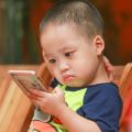 Child with smart phone