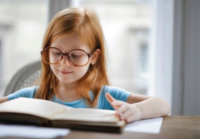 Girl reading a book for her homework | photo by Andrea Piacquadio, pexels